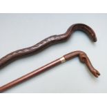 Two walking canes with novelty carved snake handles