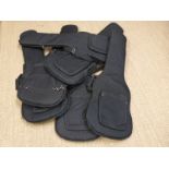 Six padded soft guitar carry cases.