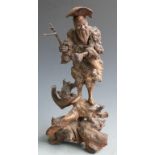 A 19thC Chinese carved bamboo root fisherman figure on carved naturalistic base, H40cm