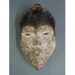 A 19thC / 20thC African tribal mask, height 28cm