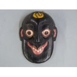 A 19thC / 20thC African tribal mask, height 18cm