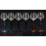 A set of six glass drinking glasses cut bowls and coloured stems and feet, 19.5cm tall