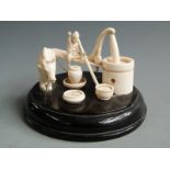 Chinese ivory scene of a man, oxen and well, H 10cm, diameter16cm