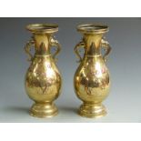 A pair of Japanese brass vases with twin elephant handles, H 34cm