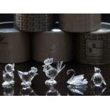Five Swarovski cut glass animals comprising two cockerels, penguin, swan and duckling