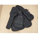 Six padded soft guitar carry cases.