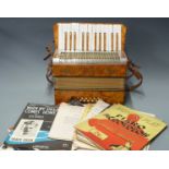 Mastertone German 12 bass piano accordion c1930's, in tangerine pearloid finish, in original carry
