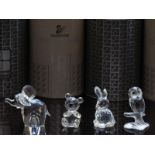 Four Swarovski cut glass animals comprising elephant, bear, owl and rabbit, all in original boxes