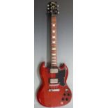 Electric lead / rhythm guitar by Vintage, in lacquered teak wood effect finish, with soft gig bag