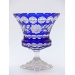 Flash overlaid cut glass chalice decorated with flowers and blue overlay over clear ground, raised