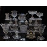 Over 50 pieces of cut glassware including cruet sets, vases, tazzas, decanters, goblets etc.