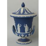 Wedgwood Jasperware covered pedestal twin-handled urn decorated with classical scenes, H 23cm
