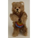 West German clockwork mohair covered tinplate drummer bear with original label to ear and key,