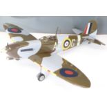 Kit built petrol powered radio controlled model Spitfire aeroplane together with the plans,