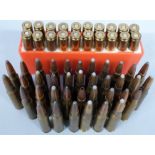 Fifty seven .308 rifle cartridges, some in a cartridge holder. PLEASE NOTE THAT A VALID RELEVANT