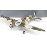 Kit built petrol powered radio controlled model Spitfire aeroplane together with the plans,