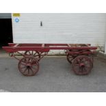 A 19thC four wheel hand cart with carved writing to wheels and frame 'Fitzalan St, SE11' 'On Hire'