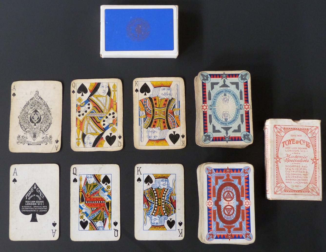 Three single packs of English playing cards with Masonic back designs