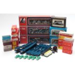 Sixteen various 00 gauge model railway wagons including motorail, TTR caboose and fruit car etc,