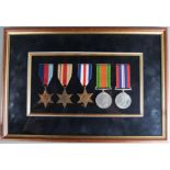 British Army WWII mounted and framed medals comprising 1939/45 Star, Africa Star, France & Germany