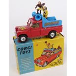 Corgi Toys diecast model Chipperfields Circus Landrover Parade Vehicle with red body, lemon