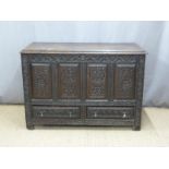 18th century carved oak mule chest with two straight drawers below and candle box within. W129 x