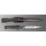 WWII German K98 bayonet stamped 3524 to the 25cm blade with matching number scabbard and leather