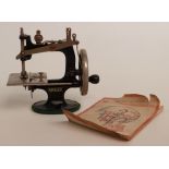 Child's Singer miniature sewing machine with original booklet