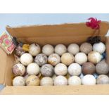 Twenty seven early Gutha Percha and later collectable golf balls together with a cricket and golf