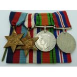 British Army WWII medals comprising the 1939/1945 Star, France & Germany Star, War Medal and Defence