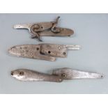 Three pairs of gun locks, all with engraved decoration, each approximately 11cm long.