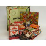A collection of vintage games including Blow Football, Snakes and Ladders, Monopoly, Roots, dominoes