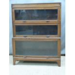 An oak Globe Wernicke style three tier glazed bookcase, W91 x D29 x H116cm