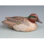 Wooden Green Winged Teal duck decoy with with painted feathers and glass eyes, signed to the base '