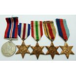 British Army WWII medals comprising the 1939-45 Star, France & Germany Star, Italy Star, Africa Star