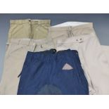 Four pairs of 32in waist breeches/jodhpurs and a pair of riding overtrousers