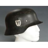 WWII German steel helmet with single swastika decal to side