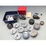 A collection of fly and coarse fishing reels including Mitchell 324, Rimfly reel with four spare