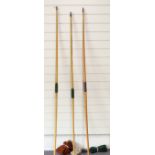Three laminated wooden archery longbows with soft cases, longest 194cm