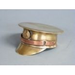 WWII trench art officers' cap made from a brass shell with copper chin strap and button badge,
