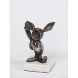 Novelty car mascot or similar in the form of a rabbit playing a banjo, on base, overall height 12cm