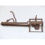 A 19thC man / bear trap of iron construction with single spring loaded mechanism and original