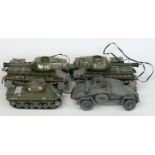 Four model tanks including two Japanese remote controlled examples, largest 23cm long