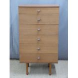 Retro Avalon chest of six straight drawers raised on shaped turned legs. W61 x D44 x H112cm