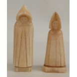 A pair of early Nordic carved walrus ivory chess pieces in the form of hooded monks, 5.7cm tall