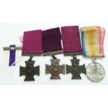 Three Victoria Cross replicas together with a copy Military Cross bar and copy Defence of Kelat-i-