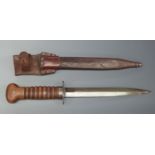 WWI Dutch fighting knife with wooden handle and 20cm double edged blade, in leather scabbard with