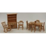 A set of wooden doll's house furniture comprising hand-crafted dining set, dresser, rocking chair