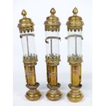 Three Victorian style brass and copper lamps, two marked GWR the other GNR