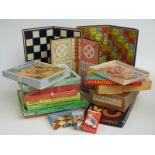 A collection of vintage games and jigsaw puzzles including Victory, Merit Solitaire, draughtsmen